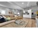 Open living area with modern kitchenette and comfortable seating at 171 Columbine St, Larkspur, CO 80118