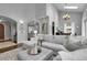 Open concept living area with vaulted ceilings and an archway to dining at 171 Columbine St, Larkspur, CO 80118
