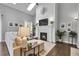 Cozy living room features a marble fireplace, plush sofa, and elegant decor with natural lighting at 171 Columbine St, Larkspur, CO 80118