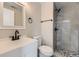 Bright bathroom features a glass door shower, updated vanity, and modern fixtures at 15689 E Eastman Pl, Aurora, CO 80013