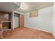 Basement with a fireplace, closet and small window at 1665 S Madison St, Denver, CO 80210