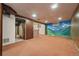 Spacious finished basement with painted mountain scene, brick bar at 1665 S Madison St, Denver, CO 80210