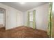 Cozy bedroom with a window, a closet door, and green floral curtains at 1665 S Madison St, Denver, CO 80210