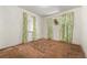Bedroom featuring large windows with green floral curtains and natural lighting at 1665 S Madison St, Denver, CO 80210