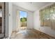 A spare bedroom featuring a door to the patio, window and old linoleum floor at 1665 S Madison St, Denver, CO 80210