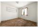 Empty bedroom featuring a window, shelf and aged carpet at 1665 S Madison St, Denver, CO 80210