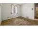 Empty bedroom featuring a window and aged carpet at 1665 S Madison St, Denver, CO 80210