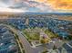 Scenic aerial view of the neighborhood with a park and mountains in the distance at 5511 Wabash St, Denver, CO 80238