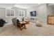Cozy basement with comfortable seating and large windows with neighborhood views at 5511 Wabash St, Denver, CO 80238