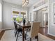 Elegant dining room featuring a wooden table, stylish chairs, and modern lighting at 5511 Wabash St, Denver, CO 80238