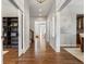 Bright hallway featuring hardwood floors and modern architectural details at 5511 Wabash St, Denver, CO 80238