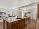 Gourmet kitchen with wooden floors, large island, and stainless-steel appliances at 5511 Wabash St, Denver, CO 80238