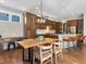 Open floor plan kitchen and dining area with modern lighting and stainless appliances at 5511 Wabash St, Denver, CO 80238