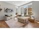Bright and airy living room with a comfortable sectional sofa and large windows at 5511 Wabash St, Denver, CO 80238