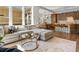Bright living room features an open concept layout, with natural light and modern décor at 5511 Wabash St, Denver, CO 80238