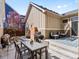 Backyard patio with an outdoor table and grill perfect for enjoying the outdoors at 5511 Wabash St, Denver, CO 80238