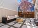 Outdoor patio with fire pit and comfortable seating, perfect for entertaining at 5511 Wabash St, Denver, CO 80238