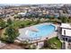 Aerial view of community pool showcasing clear water and surrounding amenities, enhancing the neighborhood's appeal at 5511 Wabash St, Denver, CO 80238
