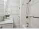 Updated bathroom featuring new tub/shower surround, modern fixtures, and a stylish vanity at 4112 S Galapago St, Englewood, CO 80110