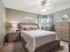 Comfortable bedroom featuring a ceiling fan, light neutral walls, and a platform bed with built-in storage at 4112 S Galapago St, Englewood, CO 80110