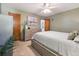 Bright bedroom with light neutral walls, ceiling fan and a large dresser, creating a relaxing space at 4112 S Galapago St, Englewood, CO 80110