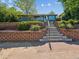 Charming home showcasing a well-manicured front yard and inviting stairway entrance at 4112 S Galapago St, Englewood, CO 80110