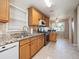 Modern kitchen featuring stainless steel appliances, granite countertops, and wooden cabinets at 4112 S Galapago St, Englewood, CO 80110