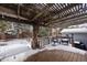 Covered patio with pergola, wicker chairs, and snow-covered deck at 3420 S Nucla Way, Aurora, CO 80013