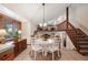 Kitchen breakfast nook with a round table and four white chairs at 3420 S Nucla Way, Aurora, CO 80013