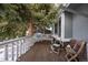 Wooden deck with two chairs, offering a peaceful outdoor space at 3420 S Nucla Way, Aurora, CO 80013