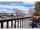 Deck overlooking a tree-lined neighborhood street at 3420 S Nucla Way, Aurora, CO 80013