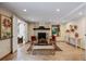 Gathering room with fireplace, tiled floor, and comfortable seating at 3420 S Nucla Way, Aurora, CO 80013