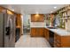 L shaped kitchen with stainless steel appliances and ample cabinet space at 3420 S Nucla Way, Aurora, CO 80013