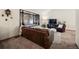 Cozy living room featuring a leather couch, window seat, and TV at 3420 S Nucla Way, Aurora, CO 80013