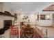 Living area with fireplace, tiled floors, and a built-in bar at 3420 S Nucla Way, Aurora, CO 80013