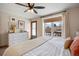 Main bedroom with king-size bed and access to a deck at 3420 S Nucla Way, Aurora, CO 80013