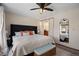 Main bedroom with king-size bed and en-suite bathroom at 3420 S Nucla Way, Aurora, CO 80013