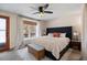 Spacious main bedroom with a king-size bed and access to a balcony at 3420 S Nucla Way, Aurora, CO 80013