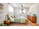 Bedroom with king-size bed and wood dresser at 991 S Holly St, Denver, CO 80246