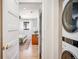 View of bedroom and laundry room with modern appliances at 991 S Holly St, Denver, CO 80246