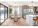 Bright dining area with wood table and chairs, near sliding doors at 991 S Holly St, Denver, CO 80246