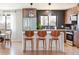 Contemporary kitchen boasting wood cabinetry and herringbone backsplash at 991 S Holly St, Denver, CO 80246