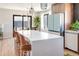 Modern kitchen with island and stainless steel appliances at 991 S Holly St, Denver, CO 80246