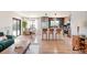 Modern kitchen with island, white countertops, and wood cabinets at 991 S Holly St, Denver, CO 80246