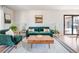 Bright living room featuring mid-century modern furniture at 991 S Holly St, Denver, CO 80246