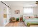 Main bedroom with a king-size bed and a view of the en-suite bathroom at 991 S Holly St, Denver, CO 80246