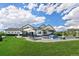 Expansive backyard featuring a pristine pool, outdoor lounge areas, and a well-maintained lawn at 2705 Fox View Trl, Franktown, CO 80116