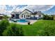 Inviting outdoor space showcasing a luxurious pool, ample seating, and manicured green lawn at 2705 Fox View Trl, Franktown, CO 80116