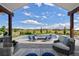 Stunning backyard featuring a gorgeous pool, relaxing seating area, and beautiful views at 2705 Fox View Trl, Franktown, CO 80116
