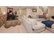 Basement living area with comfortable sectional sofa and adjacent workout space at 2705 Fox View Trl, Franktown, CO 80116
